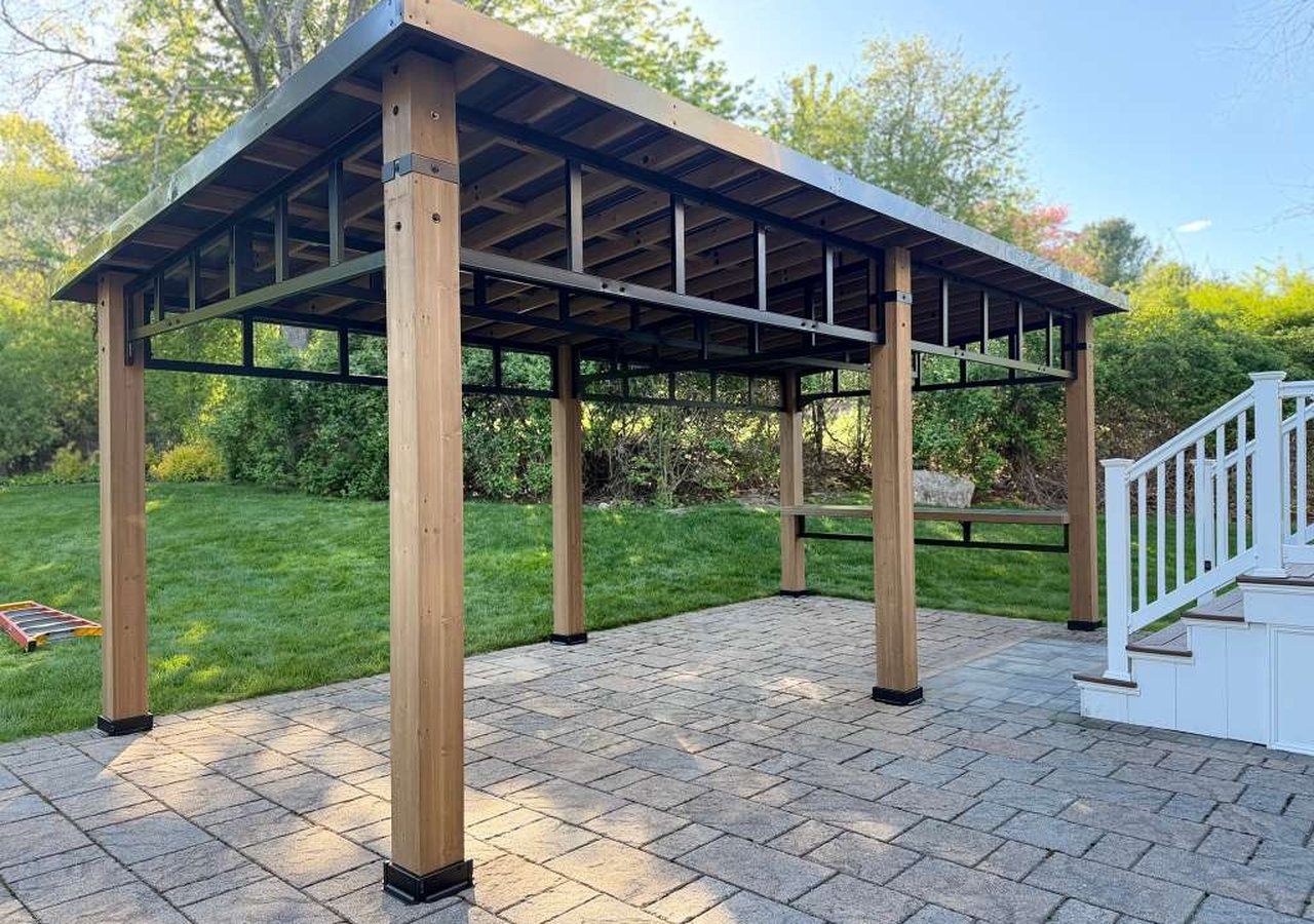 Custom outdoor pavilion on paver patio by Elite Group Carpentry